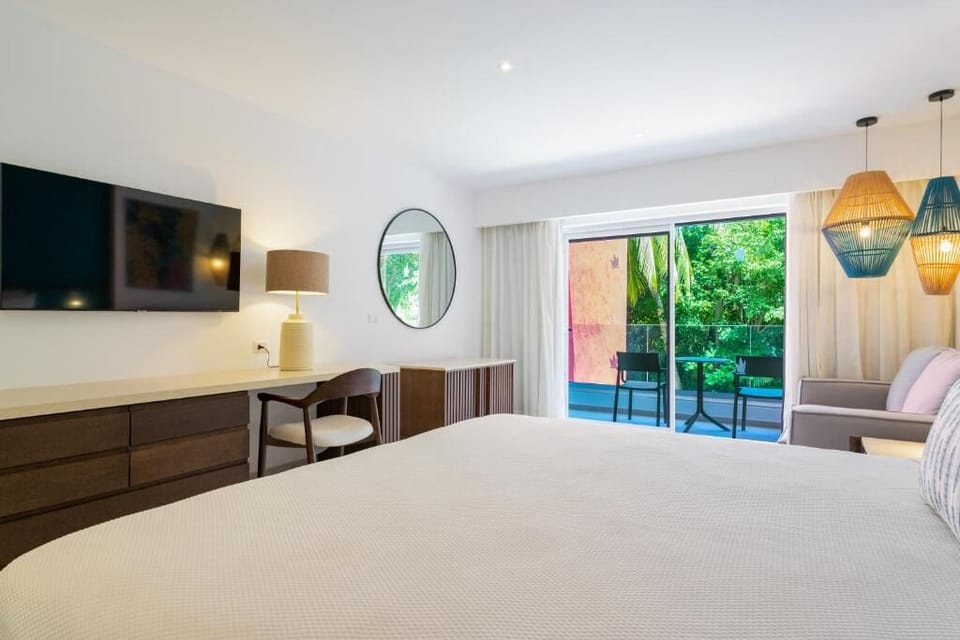 Settle in with roomy comfort, TV entertainment, and balcony light