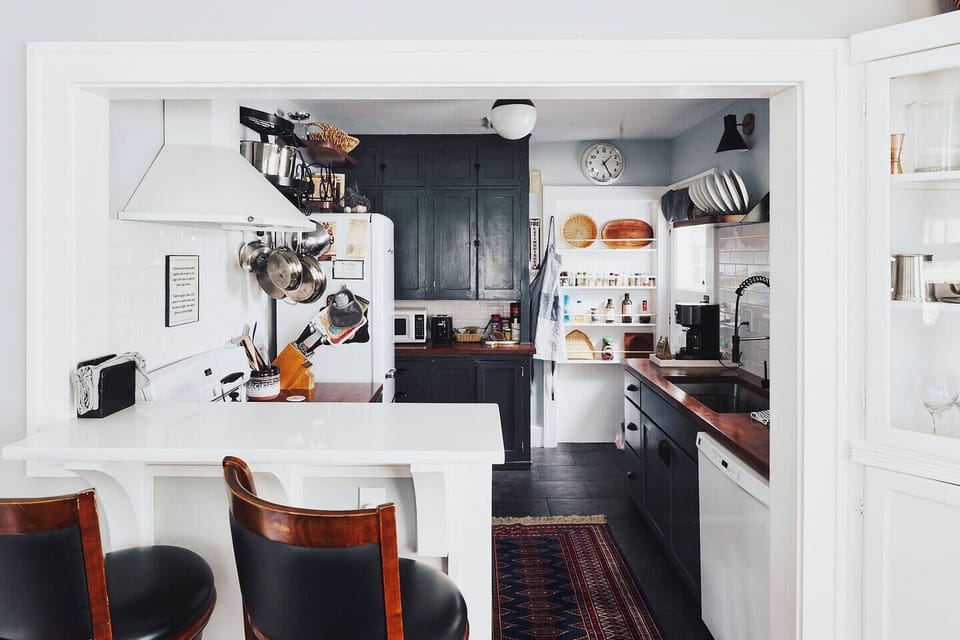 Gorgeous well lit kitchen stocked with necessary essentials