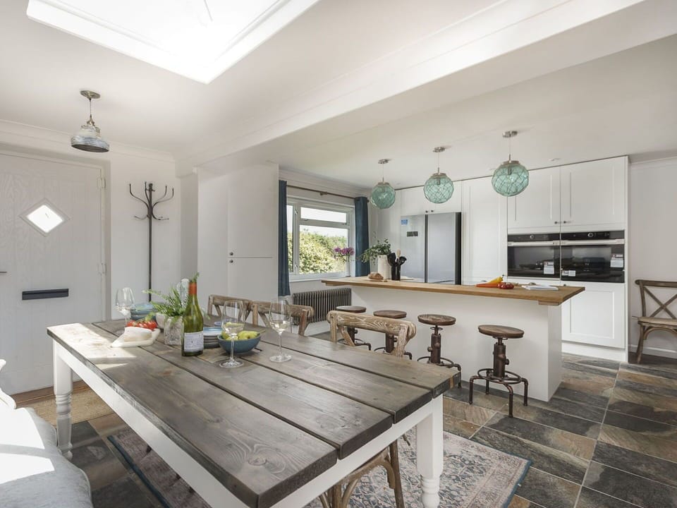 Furniture, Interior Design, Flooring, Floor, Wood, Kitchen, Ceiling, Light Fixture, Countertop, Kitchen & Dining Room Table