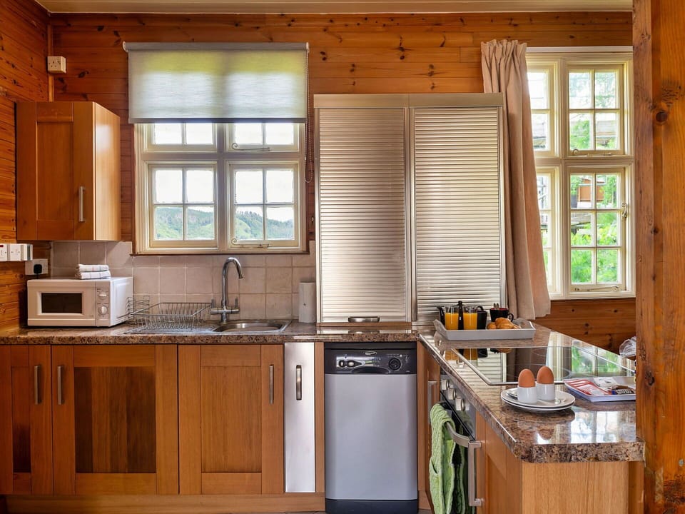 Furniture, Kitchen, Wood, Flooring, Cabinetry, Interior Design, Countertop, Kitchen Appliance, Floor, Major Appliance