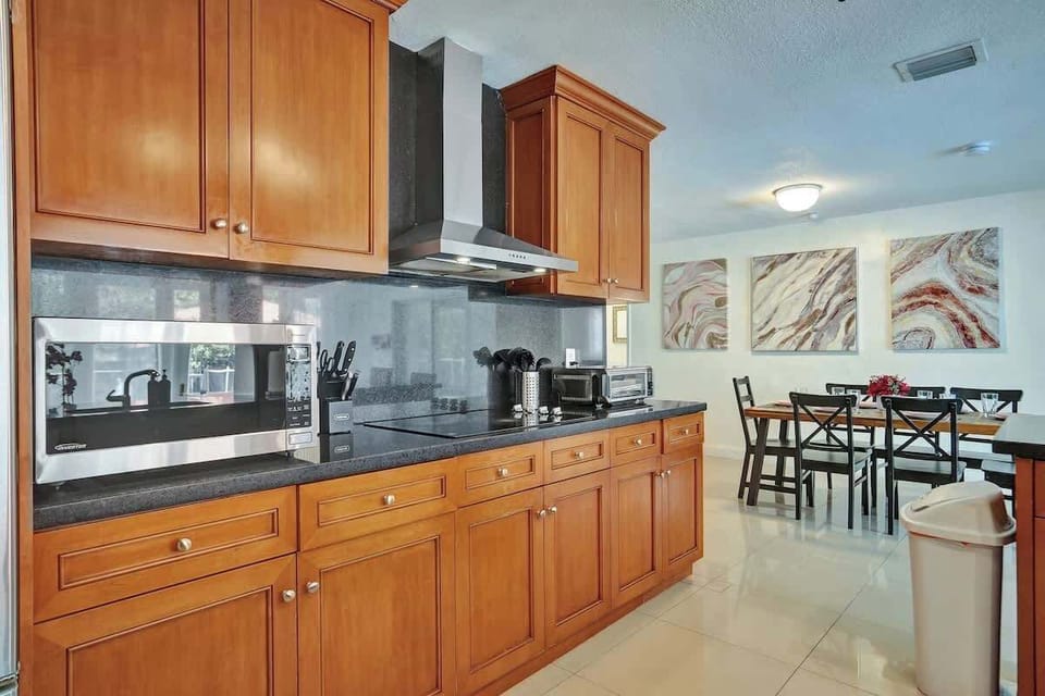  Fully equipped kitchen with modern appliances and cozy dining area—perfect for group meals and family fun. | Airbnb-friendly, vacation-ready.