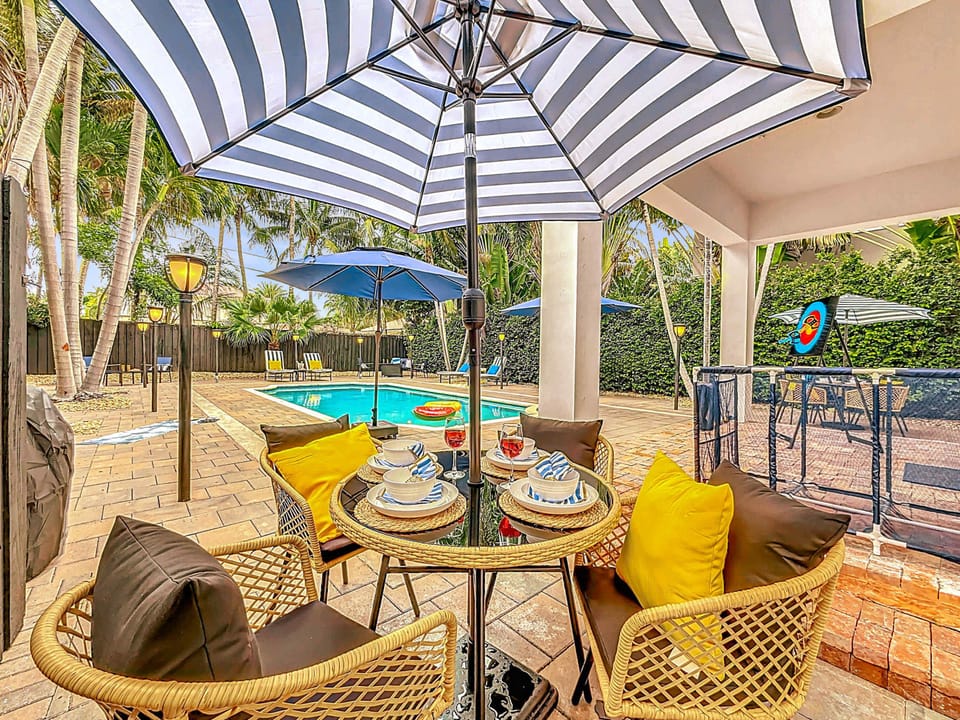 Poolside dining made easy—gather under the umbrella for fresh meals, drinks, and laughter just steps from the water. A private outdoor retreat designed for relaxation and fun. #PoolsideDining #VacationRental #OutdoorLiving #PrivateGetaway