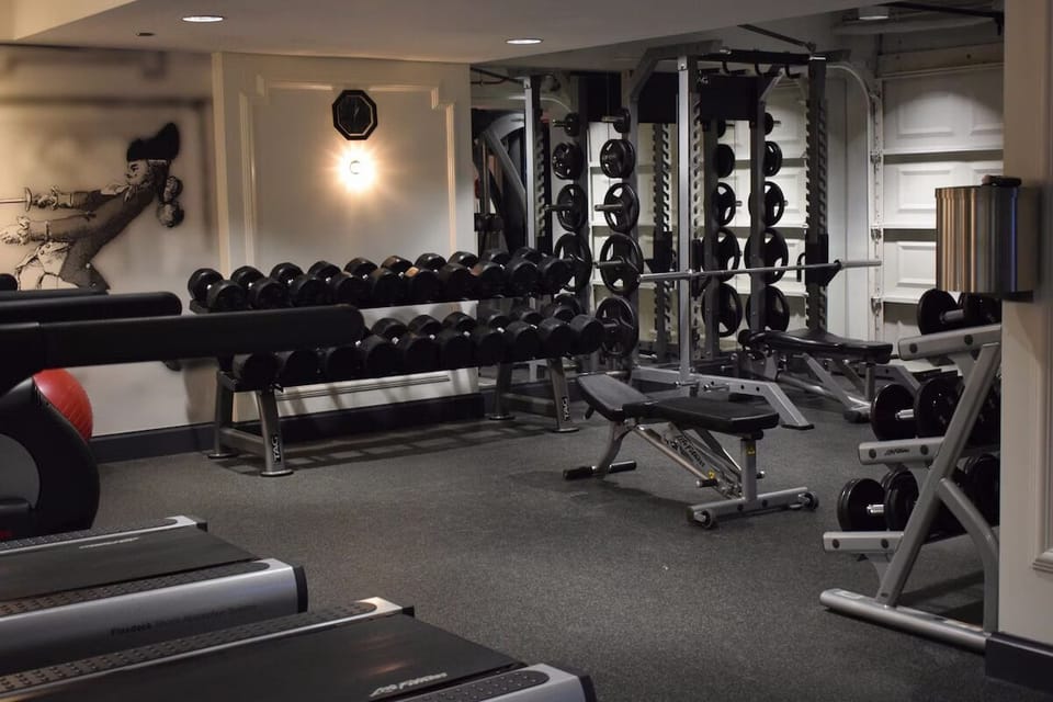 Build strength with free weights and benches in a private gym.