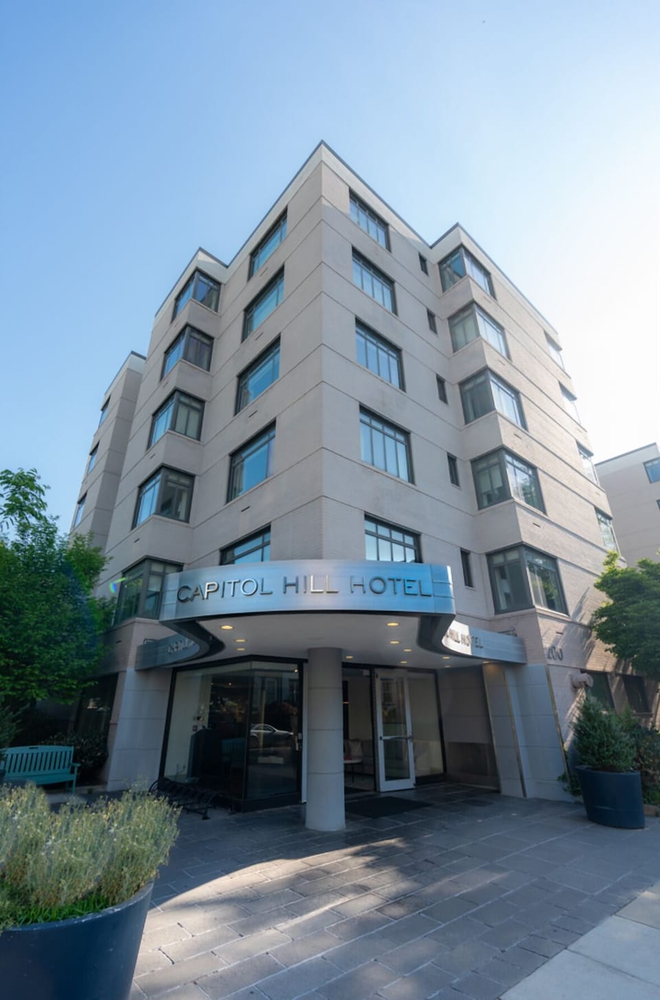 Step into the city from this polished, welcoming hotel exterior.