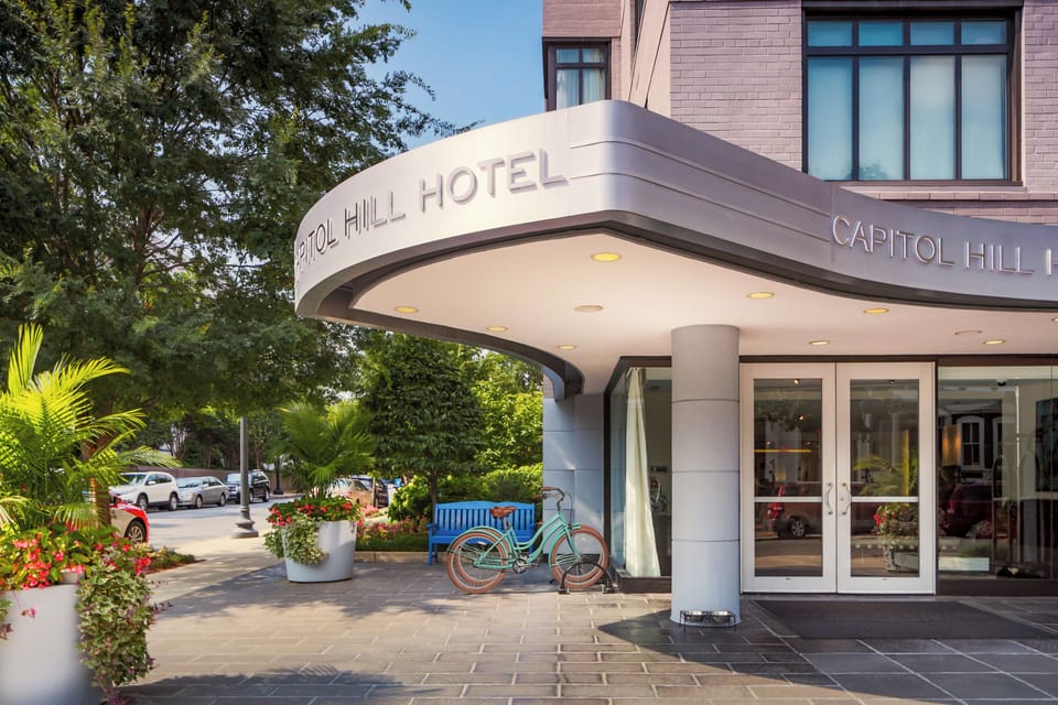 Arrive in style under the bright, welcoming hotel canopy.