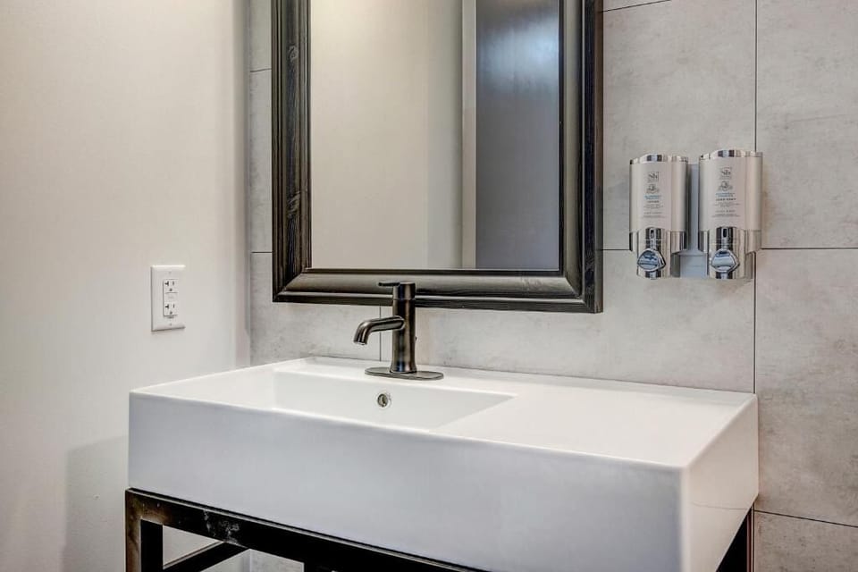 Refresh at the sleek vanity with spa-like, modern finishes.