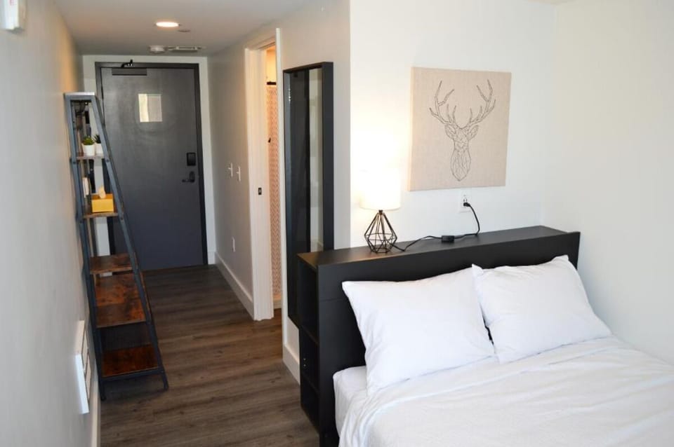Arrive and relax with an airy layout and bedside glow.