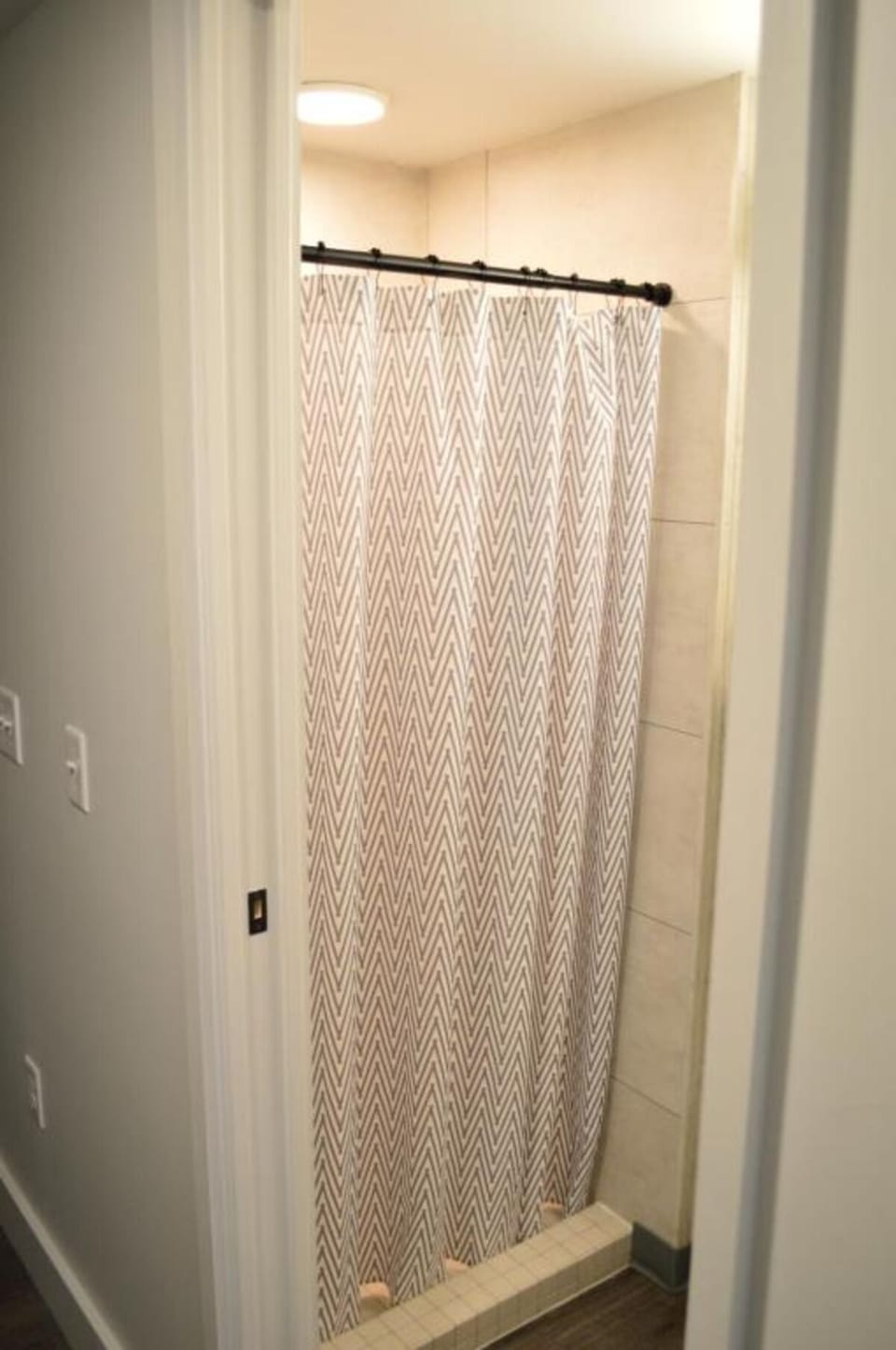 Rinse off comfortably in a clean, tiled walk-in shower.