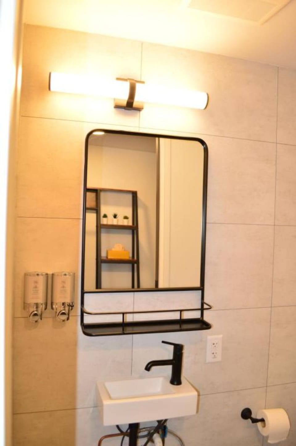 Refresh at the modern vanity with bright, spa-like lighting.