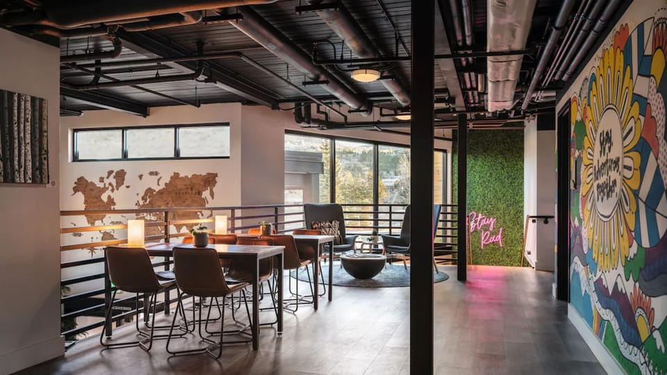 Stretch out on comfy seating under warm, ambient lighting.