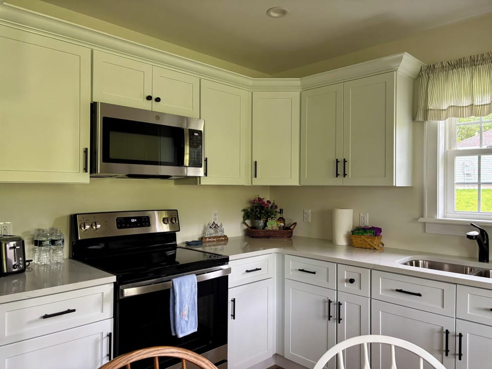 Full size kitchen with cookware, bakeware, serving dishes, and utensils.