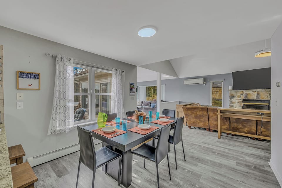 Dining table. Two additional tables in rooms over can fit for more seating.
