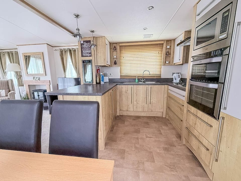 Spacious kitchen with modern appliances and cozy dining area