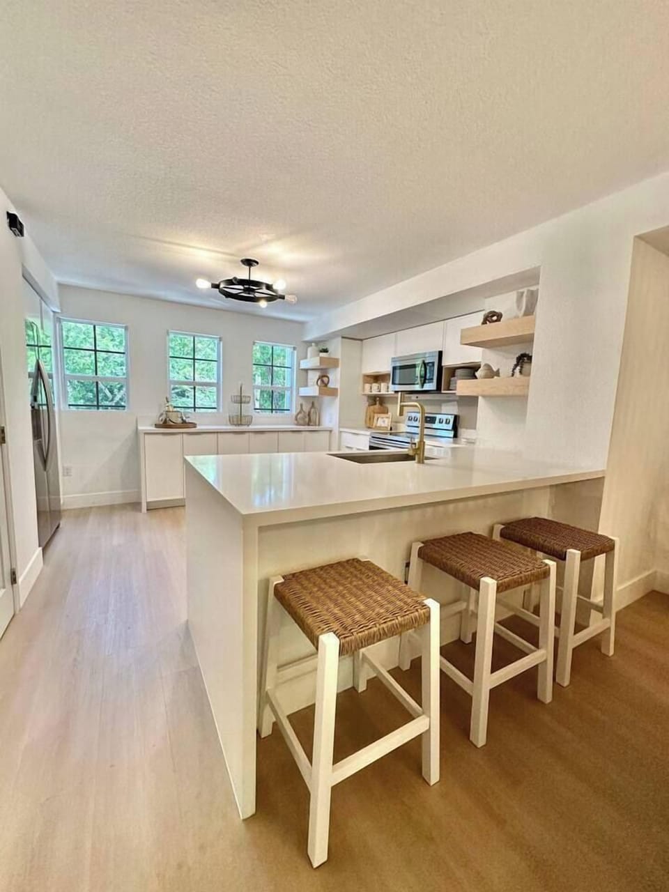 Fully stocked kitchen with island seating and everything you need for snacks, meals, or mimosas.