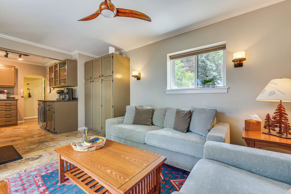 Sitting room looks onto riverside deck
