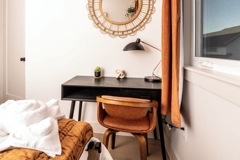 Writing desk area in secondary bedroom, perfect for a laptop setup for working from home.