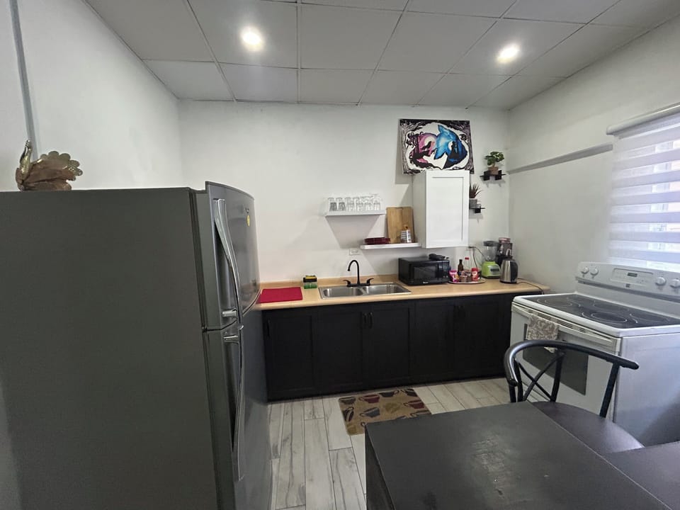 Kitchen ( blender coffee machine tea station kettle fridge, microwave stove/oven