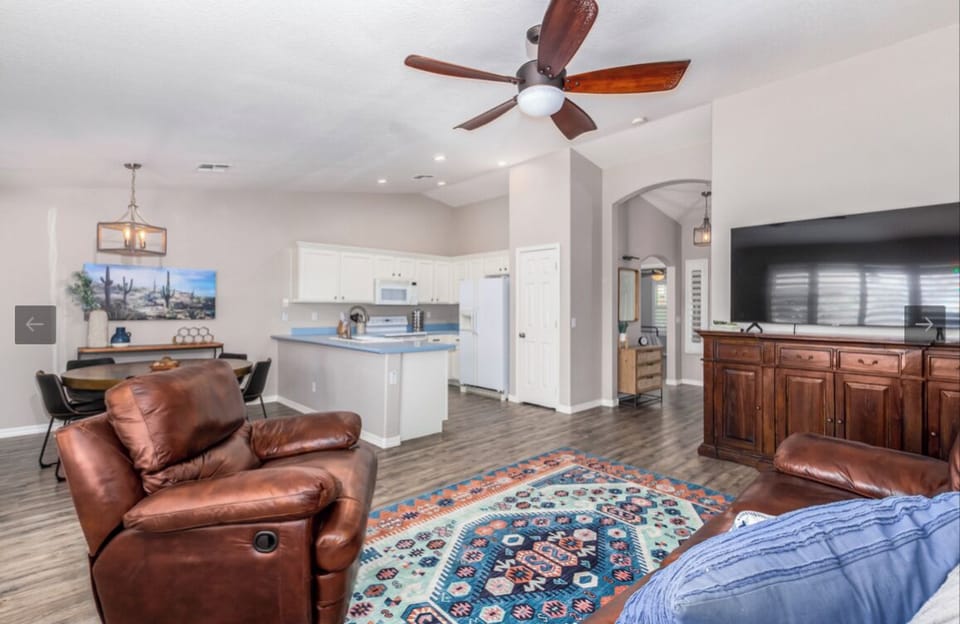 Great room with Smart TV and ceiling fan