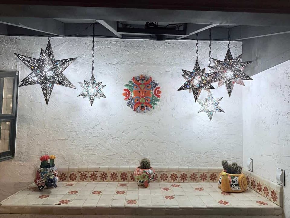 Meet the Instagram Wall. ✨ Stunning Mexican star lanterns, hand-painted tile countertop, and unique Talavera accents. The perfect backdrop for your best selfie. Get your light right and smile for the camera.