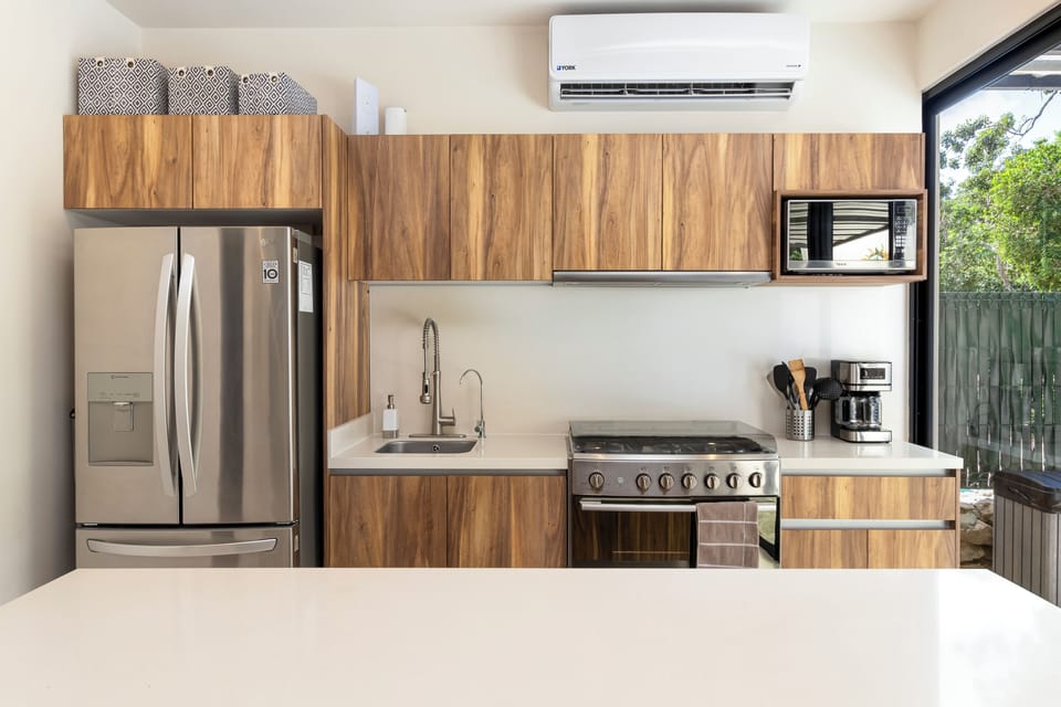 Kitchen features stainless steel appliances, microwave and all the essentials for cooking