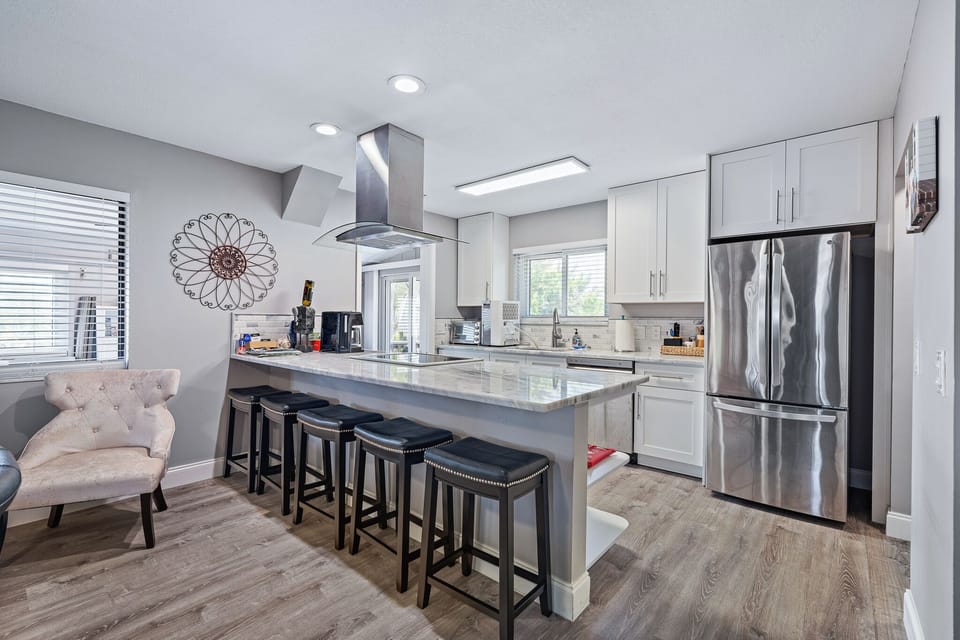 Imagine yourself cooking and enjoying friends and family sitting at the kitchen island