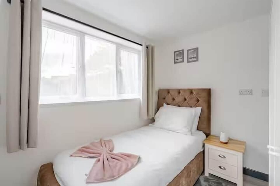 Bedroom 3: Cozy single bed, great for a child or solo traveler.