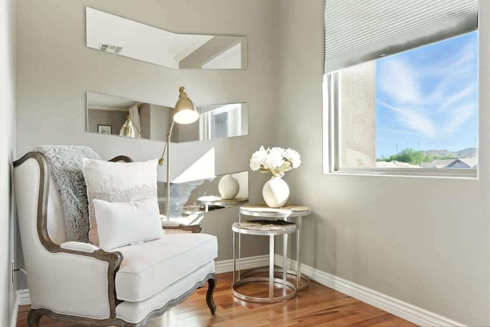 Primary bedroom with a King bed, smart TV, computer desk, reading nook, private balcony access, and en-suite bathroom with a large walk-in closet. (2nd Floor)