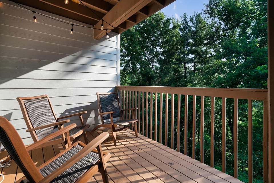 Sip morning coffee amidst the trees on this inviting deck oasis!