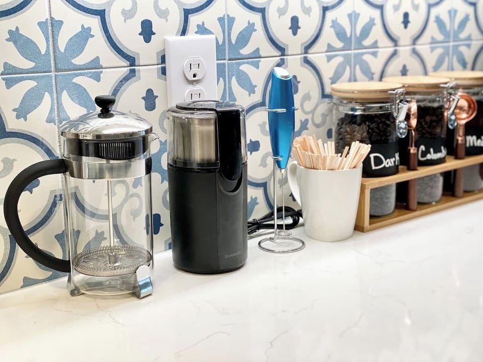 French Press, Bean Grinder, and a Frothier.