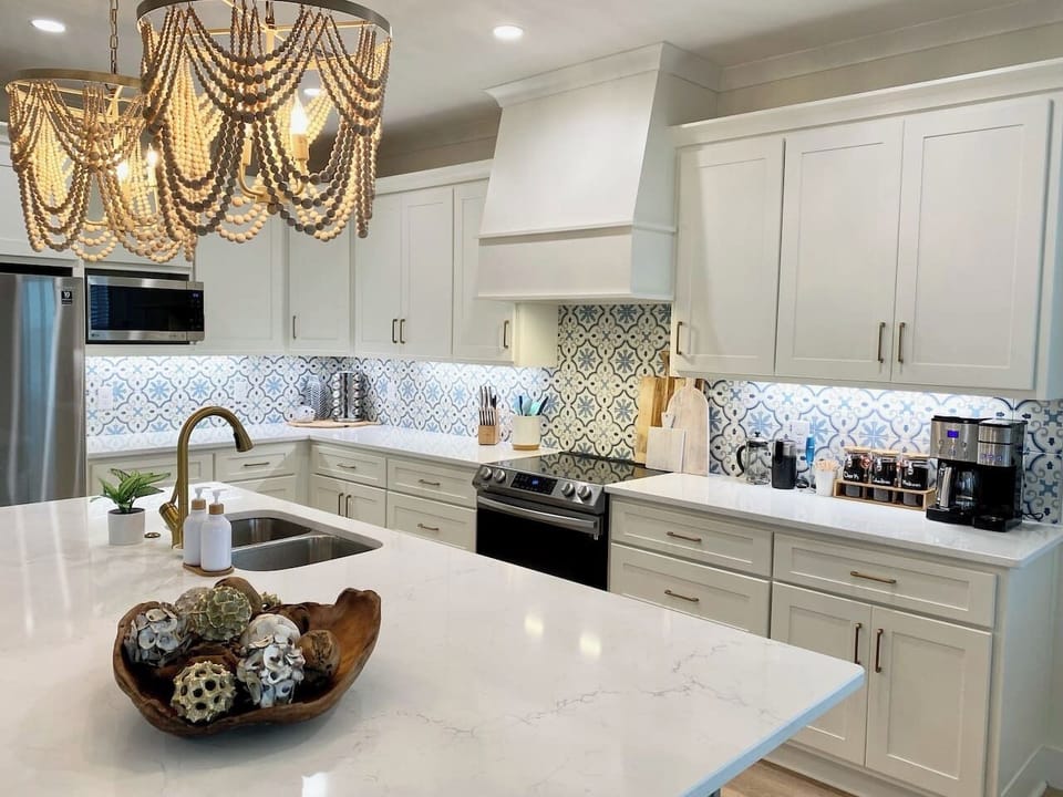 The Chef's kitchen has everything grandma will need for Christmas dinner including an additional beverage fridge under the expansive island and a fully stocked Coffee Bar to rival Starbucks sans Barista.