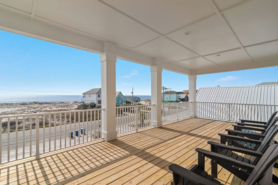 Upstairs front deck with amazing view of the beach with access form two of the King Suites.