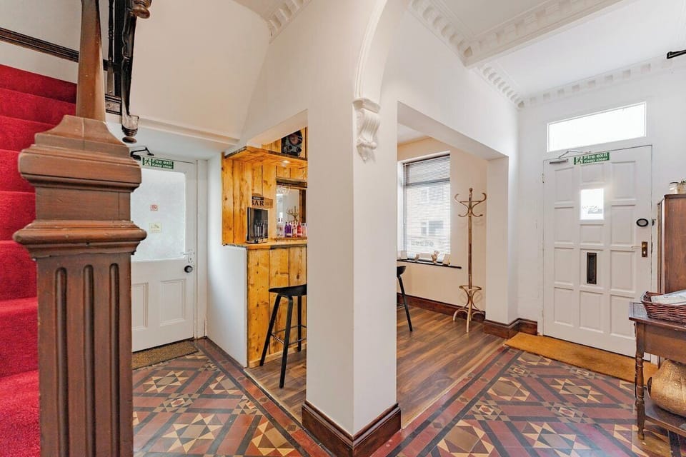 Ground floor entrance hall & Mini Pub in The Villa, as seen from the downstairs bathroom. Side door to the left, front door to the right, Banquet Hall out-of-sight on the far right.