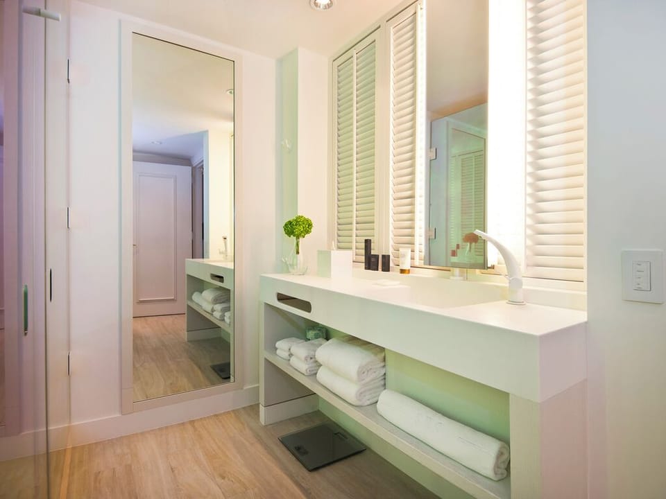 Refresh at the spa-like double vanity with plush towels.
