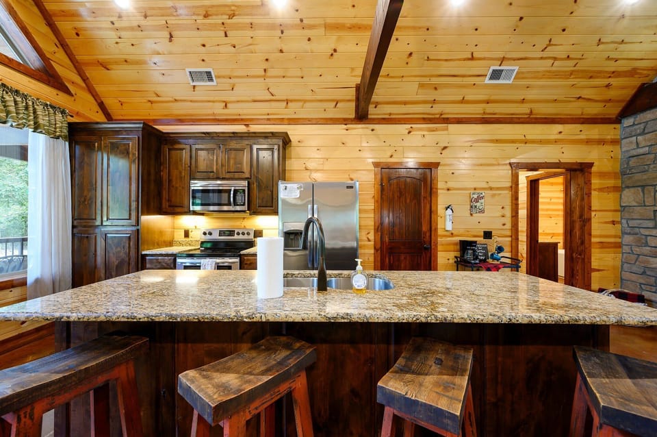 Sip morning coffee or grab a bite at the kitchen counter, seating 4​