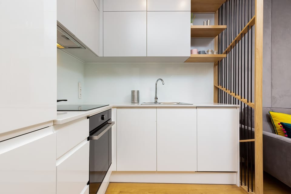Kitchenette with oven and dishwasher.