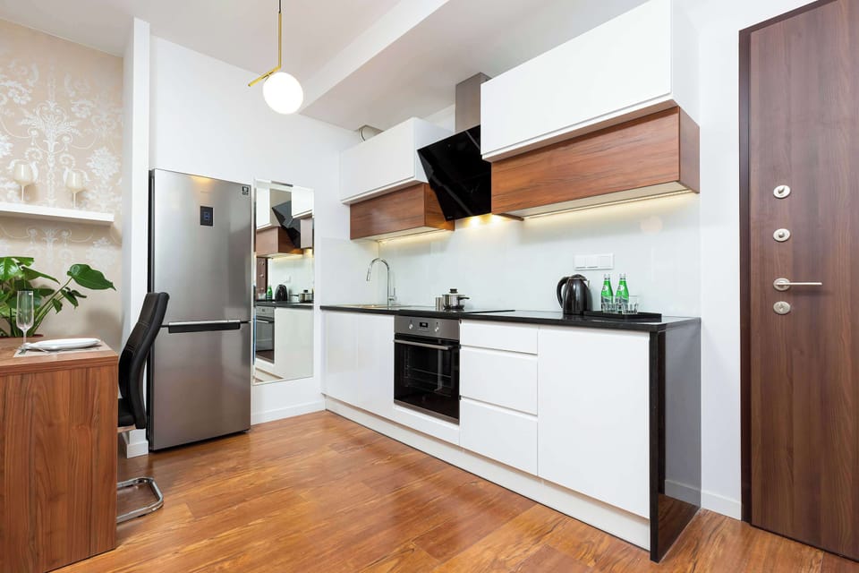 Functional kitchenette with modern appliances.