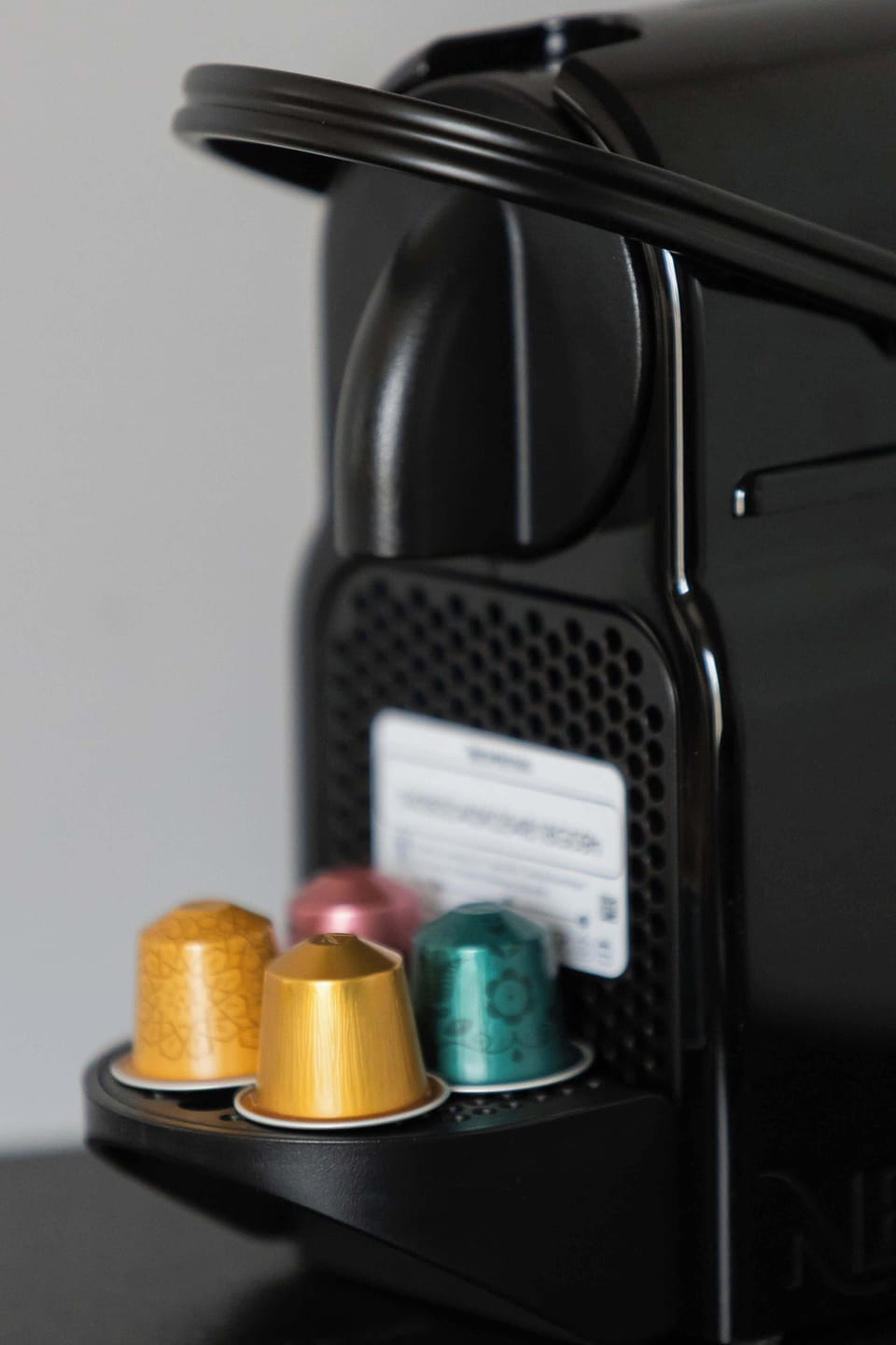 A close-up of a coffee machine with coffee capsules, adding a touch of convenience.