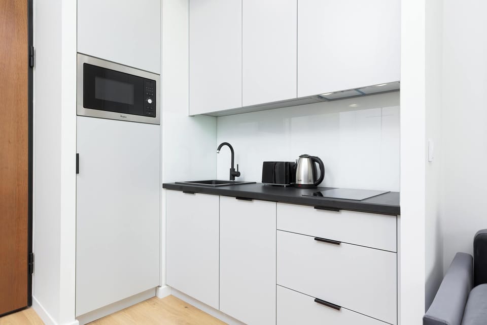 A functional kitchen space with modern cabinetry and a sink.