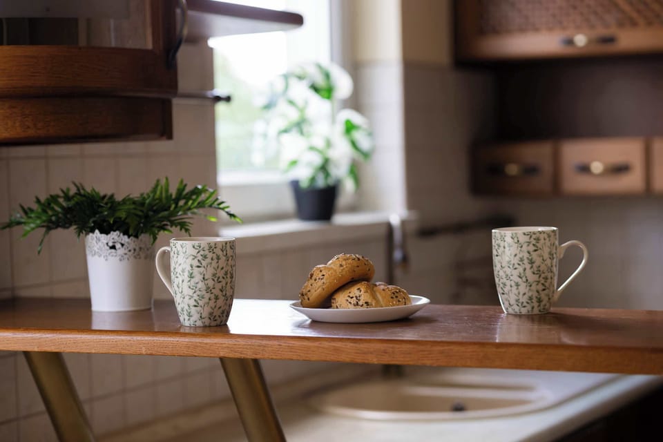 A charming table setting with fresh flowers, creating a warm and inviting atmosphere.