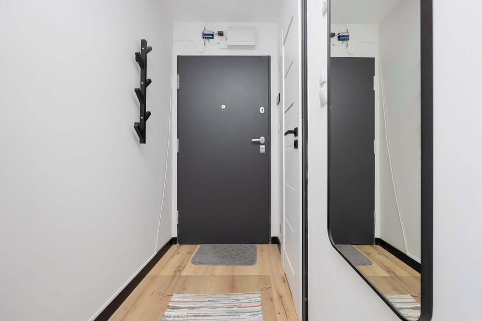Bright hallway with coat rack.