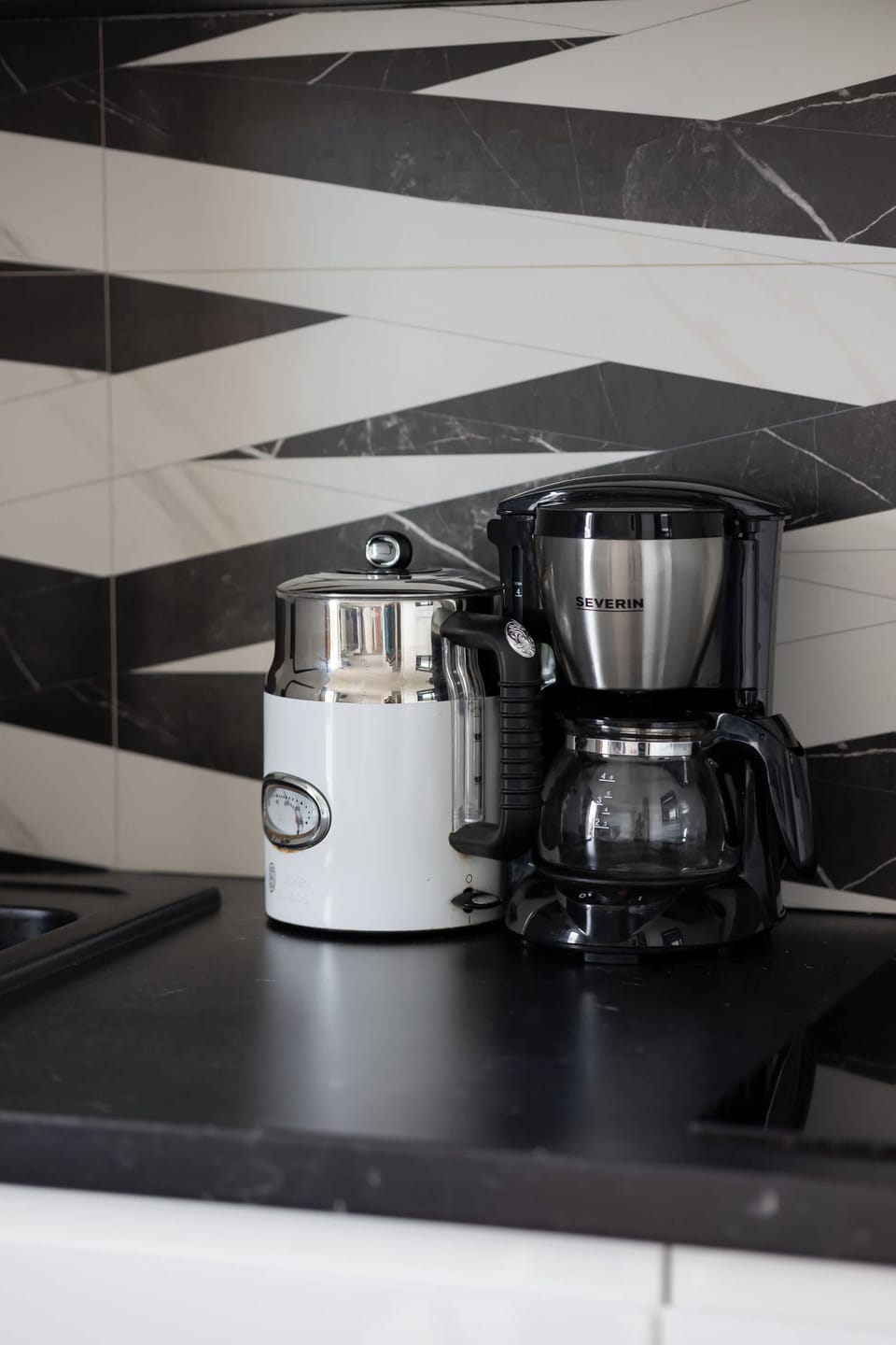 A close-up of the kitchen appliances, including a coffee machine.