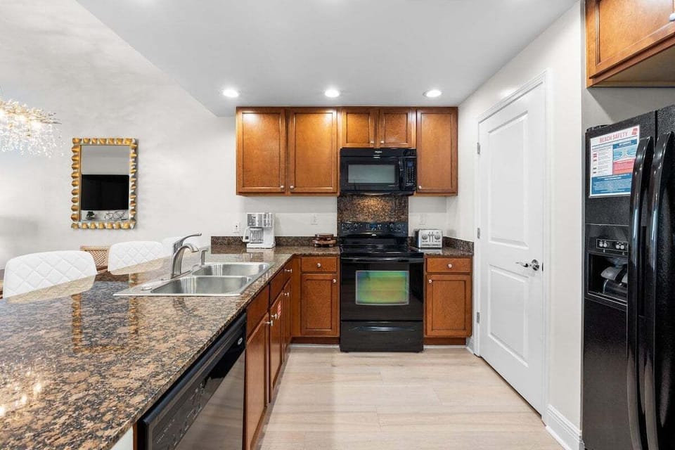 The kitchen is stocked with cooking essentials, making meal prep easy and convenient.