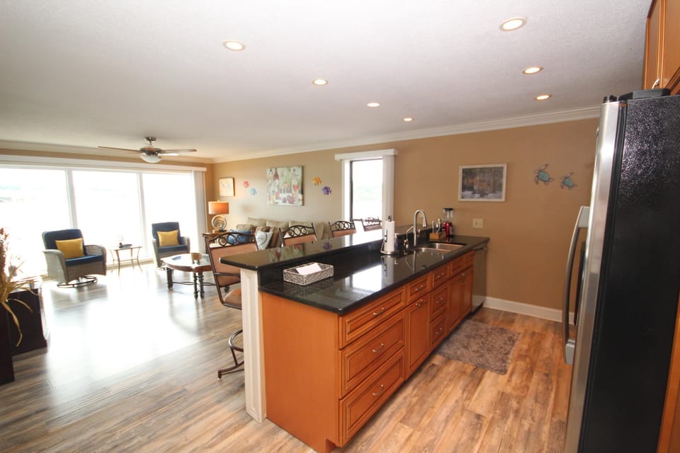 Kitchen Living Room with Floor to Ceiling Window view of the lake!