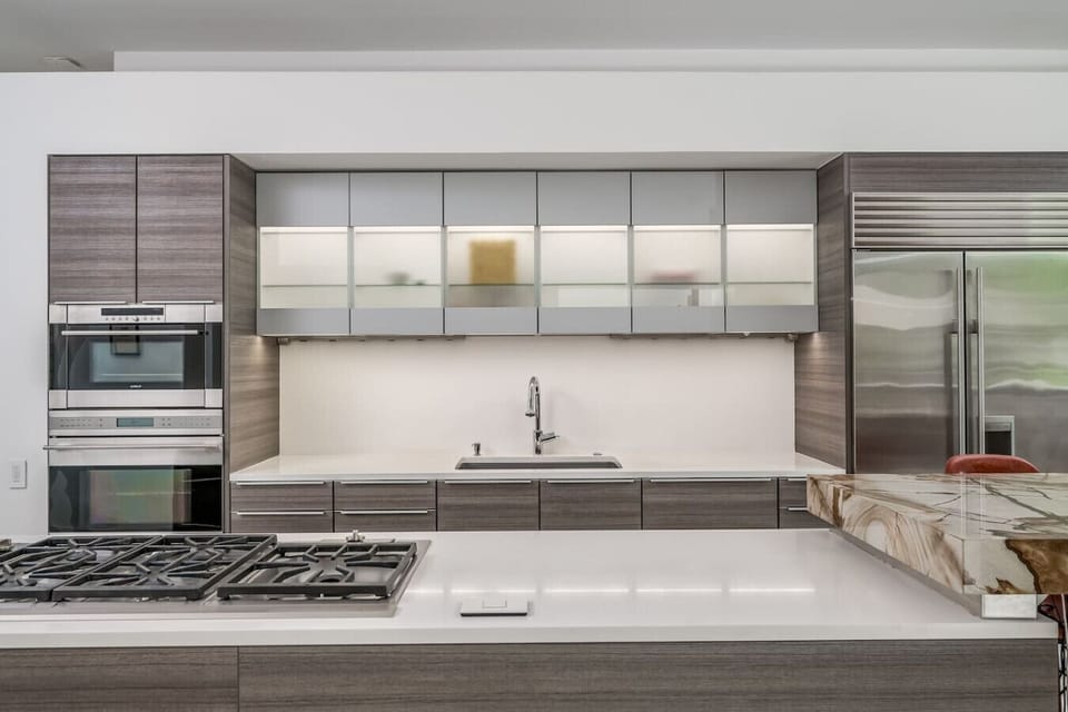 The custom chef’s kitchen is the heart of the home, custom marble, Wolf gas burners, wolf steam oven, Wolf double convection oven, Subzero refrigerator, usb ports under bar. Poggenpohl cabinetry are fully stocked for all your cooking needs