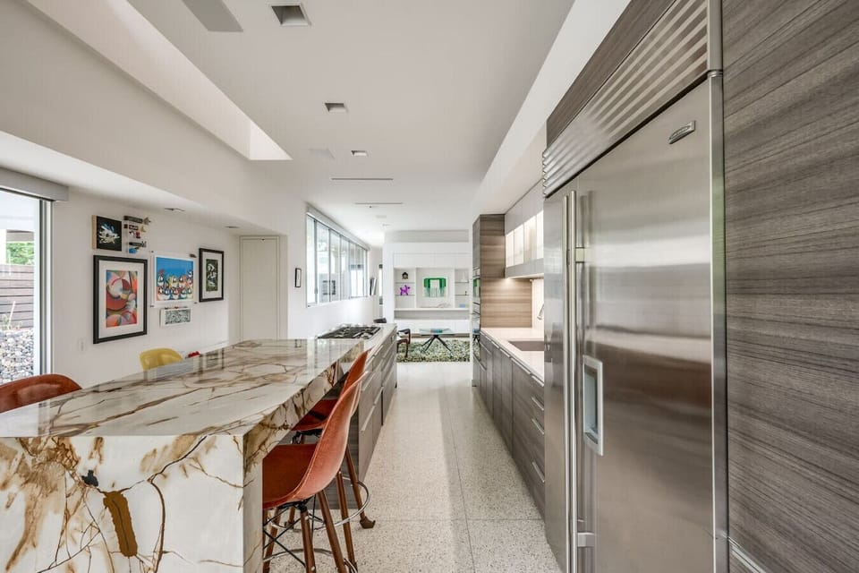 The custom chef’s kitchen is the heart of the home, custom marble, Wolf gas burners, wolf steam oven, Wolf double convection oven, Subzero refrigerator, usb ports under bar. Poggenpohl cabinetry are fully stocked for all your cooking needs