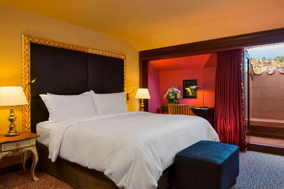Lounge in bed and step out to your private balcony.