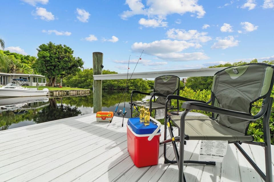 Step onto your private dock—ideal for fishing, launching kayaks, or simply unwinding while enjoying peaceful canal and mangrove views.