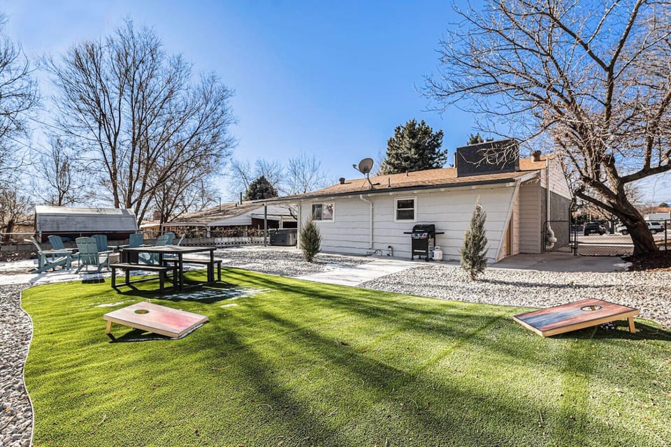 Huge backyard with fire pit, grill, and yard games