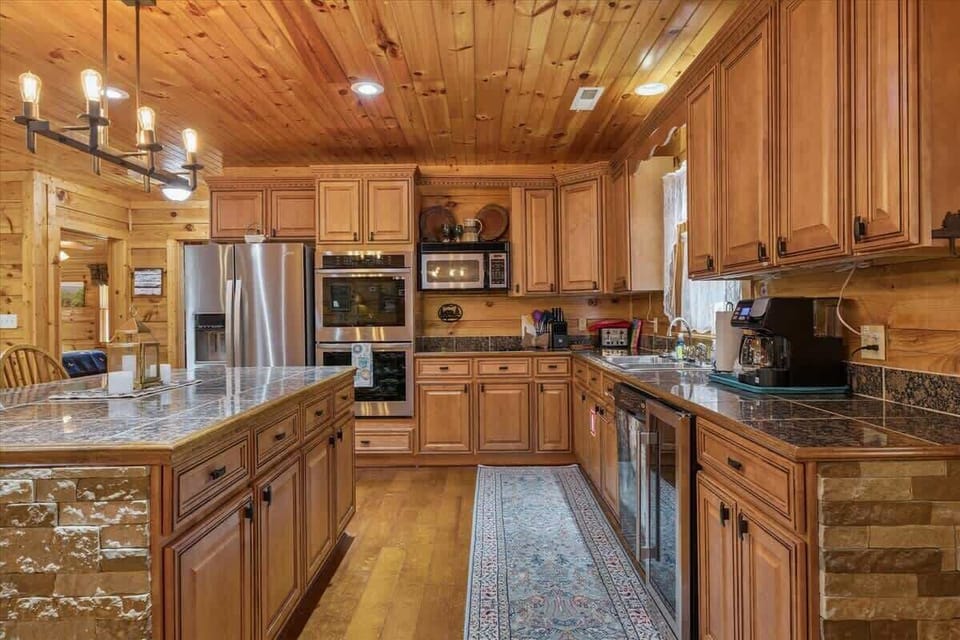 Chef's paradise with sleek appliances, charming decor, and plenty of space to gather!