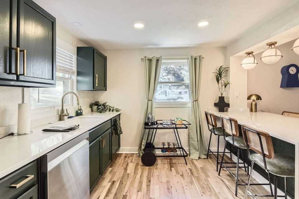 House 1: Modern, updated kitchen with eat-in bar top
